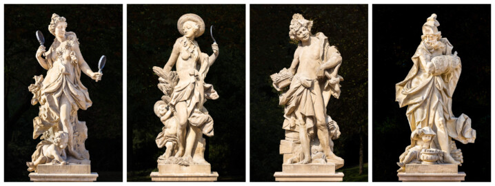 Schloss Bruchsal - Garten - Hauptachse, Süd- und Nordseite - Skulpturen (v.l.n.r.) "Der Frühling", "Der Sommer", "Der Herbst" und "Der Winter" aus dem Skulpturenensemble "Vier Jahreszeiten" (Kopien; Originale gehauen 1759 von Joachim Günther, befinden sich im Harvard Art Museum / Fogg Museum) (aufgenommen im September 2018)