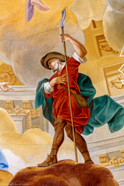 Schloss Bruchsal - Hauptbau / Corps de Logis - Beletage - Kuppelsaal - Kuppelfresko - Ausschnitt aus der südwestlichen "himmlischen" Zone - Darstellung des Bischofs Athanasius (dritter Bischof von Speyer, bis 650 n.Chr.) als Hirte dargestellt, mit rotem Gewand, Hut und Hirtenstab (urspünglich gemalt 1752 von Johannes Zick und Sohn Januarius, originalgetreu rekonstruiert 1966 von Karl Manninger) (aufgenommen im Juli 2019, am Nachmittag) Schloss Bruchsal - Hauptbau / Corps de Logis - Beletage - Kuppelsaal - Kuppelfresko - Ausschnitt aus der südwestlichen "himmlischen" Zone - Darstellung des Bischofs Athanasius (dritter Bischof von Speyer, bis 650 n.Chr.) als Hirte dargestellt, mit rotem Gewand, Hut und Hirtenstab (urspünglich gemalt 1752 von Johannes Zick und Sohn Januarius, originalgetreu rekonstruiert 1966 von Karl Manninger) (aufgenommen im Juli 2019, am Nachmittag)