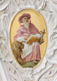 Bruchsal - Peterskirche / St. Peter - Vierungsgewölbe, Pendentif, unterhalb der Kuppel, Südwestecke - Blick auf das Bildnis von Sophronius Eusebius Hieronymus (347-420, Kirchenlehrer, Kirchenvater) (gemalt von Josef Mariano Kitschker, zwischen 1907 und 1909; aufgenommen im August 2019, um die Mittagszeit)