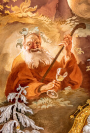 Schloss Bruchsal - Hauptbau / Corps de Logis - Beletage - Marmorsaal / Kaisersaal - Deckenfresko, äußere Zone, nordwestlich des Zentrums - Von Südosten - Ausschnitt aus dem Ewigen Göttermahl im Olymp - Darstellung eines alten Dionysos / Bacchus, Gott des Weins, mit Weinkranz und Weinglas sowie einem Hirtenstab (Deckenfresko urspünglich gemalt 1754 von Johannes Zick, originalgetreu rekonstruiert 1971 bis 1974 von Wolfram Köberl; Stuck urspünglich von Johann Michael Feuchtmayer dem Jüngeren, rekonstruiert 1962 bis 1969 von Jakob und Josef Schnitzer) (aufgenommen im Dezember 2019, am Nachmittag) Schloss Bruchsal - Hauptbau / Corps de Logis - Beletage - Marmorsaal / Kaisersaal - Deckenfresko, äußere Zone, nordwestlich des Zentrums - Von Südosten - Ausschnitt aus dem Ewigen Göttermahl im Olymp - Darstellung eines alten Dionysos / Bacchus, Gott des Weins, mit Weinkranz und Weinglas sowie einem Hirtenstab (Deckenfresko urspünglich gemalt 1754 von Johannes Zick, originalgetreu rekonstruiert 1971 bis 1974 von Wolfram Köberl; Stuck urspünglich von Johann Michael Feuchtmayer dem Jüngeren, rekonstruiert 1962 bis 1969 von Jakob und Josef Schnitzer) (aufgenommen im Dezember 2019, am Nachmittag)