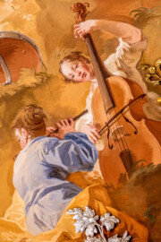 Schloss Bruchsal - Hauptbau / Corps de Logis - Beletage - Marmorsaal / Kaisersaal - Deckenfresko, äußere Zone, nordöstlich des Zentrums - Von Südwesten - Ausschnitt aus dem Ewigen Göttermahl im Olymp - Darstellung zweier Frauen mit Cello und Querflöte (Deckenfresko urspünglich gemalt 1754 von Johannes Zick, originalgetreu rekonstruiert 1971 bis 1974 von Wolfram Köberl; Stuck urspünglich von Johann Michael Feuchtmayer dem Jüngeren, rekonstruiert 1962 bis 1969 von Jakob und Josef Schnitzer) (aufgenommen im Januar 2020, am Nachmittag) Schloss Bruchsal - Hauptbau / Corps de Logis - Beletage - Marmorsaal / Kaisersaal - Deckenfresko, äußere Zone, nordöstlich des Zentrums - Von Südwesten - Ausschnitt aus dem Ewigen Göttermahl im Olymp - Darstellung zweier Frauen mit Cello und Querflöte (Deckenfresko urspünglich gemalt 1754 von Johannes Zick, originalgetreu rekonstruiert 1971 bis 1974 von Wolfram Köberl; Stuck urspünglich von Johann Michael Feuchtmayer dem Jüngeren, rekonstruiert 1962 bis 1969 von Jakob und Josef Schnitzer) (aufgenommen im Januar 2020, am Nachmittag)