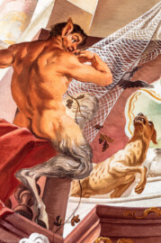 Schloss Bruchsal - Hauptbau / Corps de Logis - Beletage - Fürstensaal - Decke, untere Zone, Südwestecke - Ausschnitt aus der südwestlichen äußeren Zone - Ausschnitt aus der Darstellung der Jagd, ein wichtiger Wirtschaftszweig Bruchsals - Links (mannartige Figur); ein Faun, halb Mensch, halb Bock, ein Waldwesen, Begleiter der Jagdgöttin Artemis / Diana (Deckenfresko urspünglich gemalt 1751 von Johannes Zick, originalgetreu rekonstruiert 1966 bis 1969 von Wolfram Köberl) (aufgenommen im Januar 2020, am späten Vormittag) Schloss Bruchsal - Hauptbau / Corps de Logis - Beletage - Fürstensaal - Decke, untere Zone, Südwestecke - Ausschnitt aus der südwestlichen äußeren Zone - Ausschnitt aus der Darstellung der Jagd, ein wichtiger Wirtschaftszweig Bruchsals - Links (mannartige Figur); ein Faun, halb Mensch, halb Bock, ein Waldwesen, Begleiter der Jagdgöttin Artemis / Diana (Deckenfresko urspünglich gemalt 1751 von Johannes Zick, originalgetreu rekonstruiert 1966 bis 1969 von Wolfram Köberl) (aufgenommen im Januar 2020, am späten Vormittag)