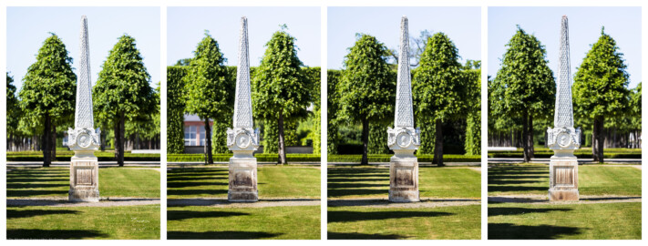 Schloss und Schlossgarten Schwetzingen - Garten - Kreisparterre, alle vier Rasenfelder - Vier Obelisken - Von Süden - Blick auf die Südseiten der vier Obelisken; v.l.n.r.: Obelisk im Südwesten, im Nordwesten, im Nordosten, im Südosten (Bildhauer: Peter Anton von Verschaffelt (1710-1793); Datierung: 1762-69; Obelisk Teil einer Vierergruppe im Kreisparterre; Material: roter Sandstein (Medaillons aus gelbem Sandstein); Fassung: Weiß; Obelisk dreigeteilt; Sockel, Block mit Medaillonbildnissen, eigentlicher Obelisk; Abmessungen: Höhe ca. 6 Meter, Sockel Höhe 155 cm / Breite 87 cm, Block mit Medaillons Höhe 67 cm / Breite 87 cm; Obelisk oben mit Tropfsteindekor) (aufgenommen im Mai 2023, am späten Nachmittag)