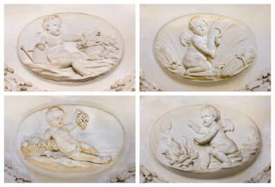 Schloss und Schlossgarten Schwetzingen - Garten - Tempel der Botanik - Von innen - Medaillons der vier Jahreszeiten, unterhalb der Kuppel - Blick auf Stuck-Medaillons mit Putti und Attributen, geschaffen von Joseph Anton Pozzi (1732-1811), die vier Jahreszeiten symbolisierend; links oben: Frühling / Südseite, rechts oben: Sommer / Westseite, links unten: Herbst / Nordseite, rechts unten: Winter / Ostseite (Tempel: Durchmesser ca. 7 Meter; Bauzeit: 1777-1780; Architekt: Nicolas de Pigage) (aufgenommen im September 2023) Schloss und Schlossgarten Schwetzingen - Garten - Tempel der Botanik - Von innen - Medaillons der vier Jahreszeiten, unterhalb der Kuppel - Blick auf Stuck-Medaillons mit Putti und Attributen, geschaffen von Joseph Anton Pozzi (1732-1811), die vier Jahreszeiten symbolisierend; links oben: Frühling / Südseite, rechts oben: Sommer / Westseite, links unten: Herbst / Nordseite, rechts unten: Winter / Ostseite (Tempel: Durchmesser ca. 7 Meter; Bauzeit: 1777-1780; Architekt: Nicolas de Pigage) (aufgenommen im September 2023)