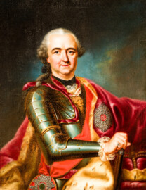 Schloss und Schlossgarten Schwetzingen - Schloss - Mittelbau - Von innen - 1. Obergeschoss - Appartment des Kurfürsten - Erstes Vorzimmer - Westwand, links der Tür zum zweiten Vorzimmer - Porträt von Kurfürst Carl Theodor (1724-1799, reg. 1742-1799); gekleidet in einer Paraderüstung mit umgehängtem Mantel, in der Rechten der Marschallstab, ganz rechts der Kurfürstenhut; an seiner linken Brust ein Bruststern des Ordens des Heiligen Hubertus (kurz Hubertusorden) mit der Abkürzung der Ordensdevise "In Treue fest" als Inschrift; an seiner rechten Seite an einer Schärpe ein Hausritterorden vom Heiligen Georg (kurz Georgsorden), der dazugehörende Löwenkopf mitten auf der Brust (Maler: Heinrich Carl Brandt (1724-1787); Datierung: um 1767) (aufgenommen im Dezember 2023, am frühen Nachmittag) Schloss und Schlossgarten Schwetzingen - Schloss - Mittelbau - Von innen - 1. Obergeschoss - Appartment des Kurfürsten - Erstes Vorzimmer - Westwand, links der Tür zum zweiten Vorzimmer - Porträt von Kurfürst Carl Theodor (1724-1799, reg. 1742-1799); gekleidet in einer Paraderüstung mit umgehängtem Mantel, in der Rechten der Marschallstab, ganz rechts der Kurfürstenhut; an seiner linken Brust ein Bruststern des Ordens des Heiligen Hubertus (kurz Hubertusorden) mit der Abkürzung der Ordensdevise "In Treue fest" als Inschrift; an seiner rechten Seite an einer Schärpe ein Hausritterorden vom Heiligen Georg (kurz Georgsorden), der dazugehörende Löwenkopf mitten auf der Brust (Maler: Heinrich Carl Brandt (1724-1787); Datierung: um 1767) (aufgenommen im Dezember 2023, am frühen Nachmittag)