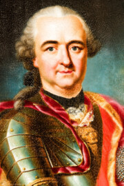 Schloss und Schlossgarten Schwetzingen - Schloss - Mittelbau - Von innen - 1. Obergeschoss - Appartment des Kurfürsten - Erstes Vorzimmer - Westwand, links der Tür zum zweiten Vorzimmer - Ausschnitt aus dem Porträt von Kurfürst Carl Theodor (1724-1799, reg. 1742-1799); gekleidet in einer Paraderüstung mit umgehängtem Mantel; an seiner linken Brust ein Bruststern des Ordens des Heiligen Hubertus (kurz Hubertusorden) mit der Abkürzung der Ordensdevise "In Treue fest" als Inschrift; mitten auf der Brust der zum Hausritterorden vom Heiligen Georg (kurz Georgsorden) gehörende Löwenkopf (Maler: Heinrich Carl Brandt (1724-1787); Datierung: um 1767) (aufgenommen im Dezember 2023, am späten Vormittag) Schloss und Schlossgarten Schwetzingen - Schloss - Mittelbau - Von innen - 1. Obergeschoss - Appartment des Kurfürsten - Erstes Vorzimmer - Westwand, links der Tür zum zweiten Vorzimmer - Ausschnitt aus dem Porträt von Kurfürst Carl Theodor (1724-1799, reg. 1742-1799); gekleidet in einer Paraderüstung mit umgehängtem Mantel; an seiner linken Brust ein Bruststern des Ordens des Heiligen Hubertus (kurz Hubertusorden) mit der Abkürzung der Ordensdevise "In Treue fest" als Inschrift; mitten auf der Brust der zum Hausritterorden vom Heiligen Georg (kurz Georgsorden) gehörende Löwenkopf (Maler: Heinrich Carl Brandt (1724-1787); Datierung: um 1767) (aufgenommen im Dezember 2023, am späten Vormittag)