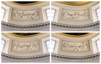 Schloss und Schlossgarten Schwetzingen - Garten - Badhaus - Von innen - Ovalsaal - Puttenfriese - Vier Felder im Tambour: spielende Putti, verbunden durch eine Blumen- und Fruchtgirlande, eingebettet in ein Feld mit Tropfenstuck, umgeben von einem glatten Rahmen; v.l.n.r., v.o.n.u.: nordwestliches, nordöstliches, südöstliches, südwestliches Feld (Stuckateur: Giuseppe Antonio Pozzi (1732–1811)) (Gesamter Bau: Länge x Breite ca. 18 x 14 Meter, Höhe ca. 10 Meter; Architekt: Nicolas de Pigage (1723-1796); Bauzeit: 1768-1772; Gesamtinstandsetzung innen und außen: 1999-2006) (aufgenommen im Oktober 2025, am Nachmittag) Schloss und Schlossgarten Schwetzingen - Garten - Badhaus - Von innen - Ovalsaal - Puttenfriese - Vier Felder im Tambour: spielende Putti, verbunden durch eine Blumen- und Fruchtgirlande, eingebettet in ein Feld mit Tropfenstuck, umgeben von einem glatten Rahmen; v.l.n.r., v.o.n.u.: nordwestliches, nordöstliches, südöstliches, südwestliches Feld (Stuckateur: Giuseppe Antonio Pozzi (1732–1811)) (Gesamter Bau: Länge x Breite ca. 18 x 14 Meter, Höhe ca. 10 Meter; Architekt: Nicolas de Pigage (1723-1796); Bauzeit: 1768-1772; Gesamtinstandsetzung innen und außen: 1999-2006) (aufgenommen im Oktober 2025, am Nachmittag)