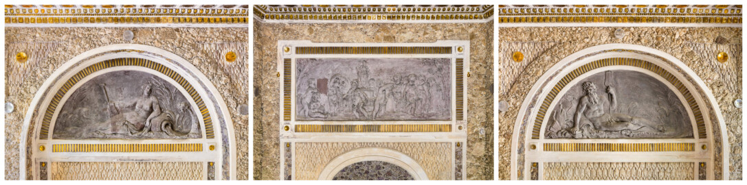 Schloss und Schlossgarten Schwetzingen - Garten - Badhausanlage - Östliches Achathäuschen - v.l.n.r.: Nordwand, Ostwand, Südwand - Blick auf Teile der Wände sowie auf zwei Lünetten und ein Rechteckfeld mit Bleireliefs; links: Darstellung einer Quellennymphe, von Schilfgras eingerahmt; linker Arm gestützt auf Urne, aus der Wasser fließt; rechter Arm ein Ruder haltend; links ein Putto im Schilf; Mitte: Darstellung eines Erotentanzes um die Statue der Göttin Flora; Flora auf einem Podest stehend, in der Rechten ein Blumenkranz; zehn Putti im Ringeltanz um Flora, teils durch eine Girlande verbunden; links zwei weitere Putti, einander liebkosend; Szene links und rechts eingerahmt durch Bäume; rechts: Darstellung eines bärtigen Flussgottes, gegen einen Felsen lehnend, umgeben von Schilfgras; rechte Hand auf Steine gestützt, mit linker Hand ein Ruder haltend; zwischen rechtem Arm und Hüft eine Urne, aus der Wasser läuft (Bildhauer: Franz Conrad Linck (1730-1793), Datierung: um 1770-1775, Material: Blei, Signatur am mittleren Relief, unten rechts (schwach lesbar): "Linck. F", Breite x Höhe: ca. 125 x 58 Zentimeter) (Achathäuschen: Abmessungen Breite x Tiefe x Höhe 3,2 x 3,0 x 6,4 Meter, Innenraum Breite x Tiefe ca. 2 x 2 Meter; Architekt: Nicolas de Pigage, Fertigstellung: um 1775, Instandsetzung: 1991 - 1995) (aufgenommen im Mai 2026, am späten Vormittag) Schloss und Schlossgarten Schwetzingen - Garten - Badhausanlage - Östliches Achathäuschen - v.l.n.r.: Nordwand, Ostwand, Südwand - Blick auf Teile der Wände sowie auf zwei Lünetten und ein Rechteckfeld mit Bleireliefs; links: Darstellung einer Quellennymphe, von Schilfgras eingerahmt; linker Arm gestützt auf Urne, aus der Wasser fließt; rechter Arm ein Ruder haltend; links ein Putto im Schilf; Mitte: Darstellung eines Erotentanzes um die Statue der Göttin Flora; Flora auf einem Podest stehend, in der Rechten ein Blumenkranz; zehn Putti im Ringeltanz um Flora, teils durch eine Girlande verbunden; links zwei weitere Putti, einander liebkosend; Szene links und rechts eingerahmt durch Bäume; rechts: Darstellung eines bärtigen Flussgottes, gegen einen Felsen lehnend, umgeben von Schilfgras; rechte Hand auf Steine gestützt, mit linker Hand ein Ruder haltend; zwischen rechtem Arm und Hüft eine Urne, aus der Wasser läuft (Bildhauer: Franz Conrad Linck (1730-1793), Datierung: um 1770-1775, Material: Blei, Signatur am mittleren Relief, unten rechts (schwach lesbar): "Linck. F", Breite x Höhe: ca. 125 x 58 Zentimeter) (Achathäuschen: Abmessungen Breite x Tiefe x Höhe 3,2 x 3,0 x 6,4 Meter, Innenraum Breite x Tiefe ca. 2 x 2 Meter; Architekt: Nicolas de Pigage, Fertigstellung: um 1775, Instandsetzung: 1991 - 1995) (aufgenommen im Mai 2026, am späten Vormittag)