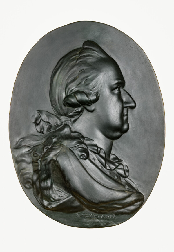 Schloss und Schlossgarten Schwetzingen - Schloss - Mittelbau - Von innen - 1. Obergeschoss - Appartment des Kurfürsten - Konferenzzimmer - Südwand, rechts der Mitte - Portrait-Relief von Kurfürst Carl Theodor (1724-1799, reg. 1742-1799) (Bildhauer: Franz Conrad Linck (1730-1793), Datierung: 1777; Material: Gips, schwarz gefärbt) (aufgenommen im Januar 2024, am Nachmittag)
